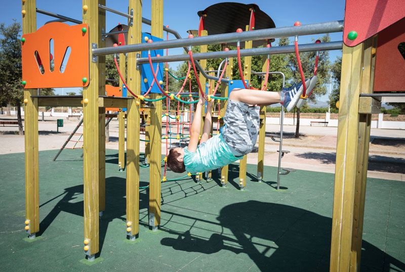 child playing in a children's equipment
